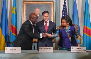 DRC and Rwanda Sign Washington Accords to End Conflict Foreign ministers of DRC and Rwanda shake hands while signing peace documents as US Secretary of State looks on in Washington ceremony.