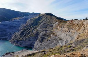 Apple Dell Google Microsoft Tesla Sued Over Congo Child Cobalt Deaths Children carry sacks of cobalt ore from a hand-dug tunnel in a Congolese mine under a hazy sky.