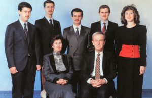 Bashar al-Assad Ousted After 53-Year Family Rule Bashar al-Assad speaking at a podium with Syrian flags in background