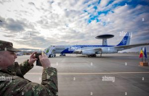 NATO Deploys AWACS Planes to Romania to Track Russia Three Boeing E-3 Sentry AWACS aircraft with rotating radar domes sit on a runway at Geilenkirchen airbase in Germany.