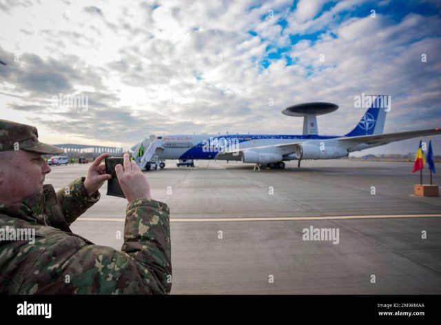 Awacs Otopeni Airbase Nato Romania Three Boeing E-3 Sentry AWACS aircraft with rotating radar domes sit on a runway at Geilenkirchen airbase in Germany.