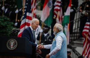 Biden Presses Modi for Harder Line on Russia President Joe Biden and Indian Prime Minister Narendra Modi sit at a conference table during diplomatic talks.