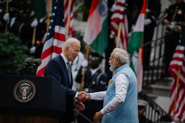 Biden Modi Wilmington Meeting Russia President Joe Biden and Indian Prime Minister Narendra Modi sit at a conference table during diplomatic talks.