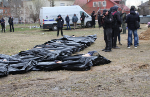 Ukraine Finds 410 Civilians Shot, Burned in Bucha Bodies of civilians lie scattered on a street in Bucha, Ukraine, after Russian troops withdrew from the area.