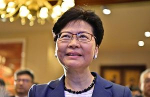 Carrie Lam Says Hong Kong Financial System Stable Carrie Lam speaking at an Asian Financial Forum event in Hong Kong, addressing business leaders and investors.