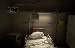 CDC Report Shows COVID-19 Fatality Rates Rise With Age A CDC report document on a desk shows COVID-19 fatality data by age group, with a chart highlighting higher death rates for older adults.
