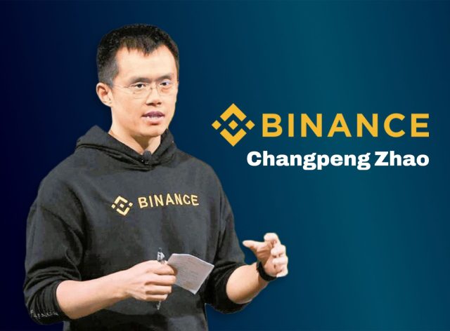 Changpeng Zhao Binance Ceo Resignation Changpeng Zhao speaking at a cryptocurrency conference, with Binance logo visible in the background.