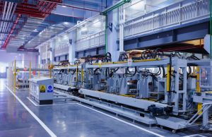 Chip Equipment Sales Hit Record US$108.5 Billion A technician inspects a wafer etching machine in a cleanroom semiconductor fab facility.