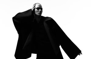 Met Gala 2025 Renamed Superfine Tailoring Black Style Guests in formal attire ascend the Met Gala steps under bright lights, with the Metropolitan Museum of Art facade in the background.