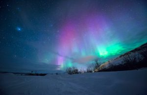 Scientists Name May 2024 Solar Storms Gannon Storm Green and pink aurorae illuminate the night sky over Texas during the May 2024 Gannon solar storm.