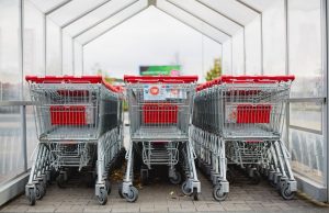 EU Deforestation Law Mandates Plot Coordinates by Dec 2024 Aerial view of a cleared forest plot with a cargo ship carrying timber in the background, illustrating the EU's new commodity traceability rules.