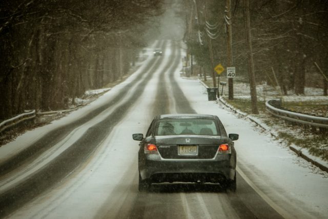 Two States Account for Most of the 89 US Winter Storm Deaths Snow-covered roads and damaged power lines in a residential area after a winter storm