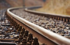 Tamil Nadu Train Collision Injures 19, Strains Hospitals Rescue teams work at the site of a train collision near Chennai, with debris scattered across the tracks and emergency vehicles nearby.