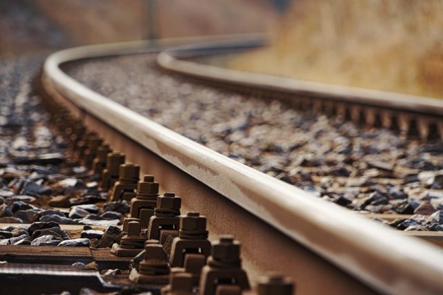 Tamil Nadu Train Collision Leaves 19 Injured, Families Face Uncertainty Rescue teams work at the site of a train collision near Chennai, with debris scattered across the tracks and emergency vehicles nearby.