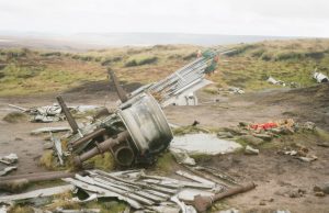 Seven Die in Cessna 207 Crash in Jalisco A Cessna 207 single-engine plane wreckage lies scattered on a rugged hillside in El Montoso, Jalisco, with rescue crews navigating the remote terrain.