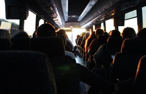 Driver Fatigue Cited in Laos Bus Crash That Killed Five A damaged bus rests against a tree on a roadside in Laos after a fatal crash.