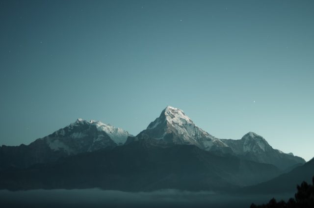 Lightning Kills Three Experienced Hikers on Austrian Mountain Peak Three hikers ascend a rocky ridge on Mittagsspitze under dark storm clouds in the Central Eastern Alps.