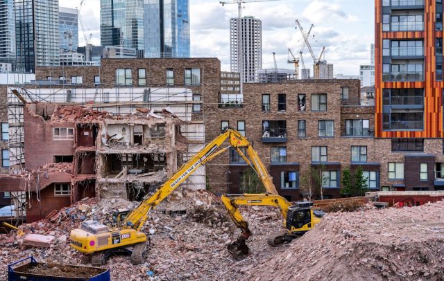 Karachi's Deadly Building Collapse Highlights Risks of Aging Infrastructure Rescue workers search through rubble of a collapsed building in a densely packed Karachi neighborhood.