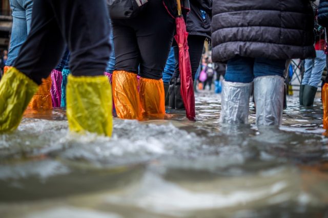 Evacuation of Poznań office building highlights infrastructure strain from severe storm People evacuating the Bałtyk office building in Poznań as floodwaters surround the tower during a severe thunderstorm.