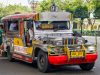 Jeepney Crash Kills 4, Injures 10 in Philippines A colorful jeepney with chrome details and hand-painted scenes on a rural road in Oriental Mindoro, Philippines.