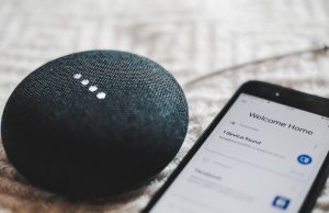 Amazon Fuses Nova, Claude Models in Alexa+ Overhaul Amazon Echo speaker glowing blue on a table as Alexa+ processes a voice command using Nova and Claude AI models.