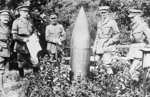 WWII Bomb Cancels 80 Flights at Miyazaki Airport Ground crew inspect a crater left by a WWII bomb blast on a taxiway at Miyazaki Airport while flights remain grounded.
