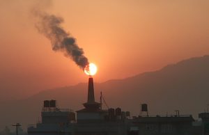 Lahore Air Index Hits 1,900, Schools Closed Smog blankets Lahore cityscape as children walk near closed school gates under hazy skies.
