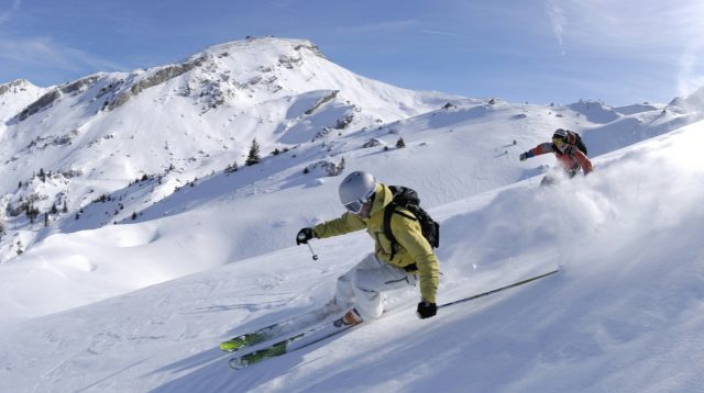 Avalanche in Alaska's Chugach Mountains Traps Skiers Under Deep Snow Rescue teams search a massive pile of snow in the Chugach Mountains after an avalanche trapped three skiers.