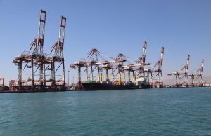 Iran Port Blast Death Toll Hits 40, 1,205 Injured Rescue workers search through debris at the Port of Shahid Rajaee in Bandar Abbas after a massive explosion destroyed the facility.