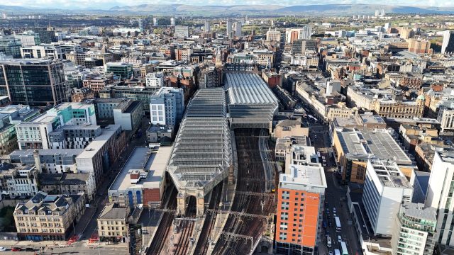 Fire Destroys Historic Building Near Glasgow Central Railway Station Firefighters battle a large blaze engulfing a historic building next to Glasgow Central railway station, with smoke billowing over the city.