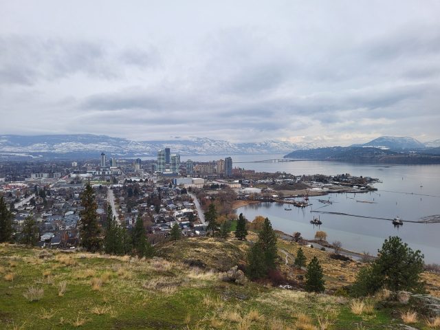 Kelowna declares emergency as wildfires destroy buildings and force evacuations Smoke rising over Kelowna, British Columbia, as wildfires approach residential areas near Okanagan Lake.