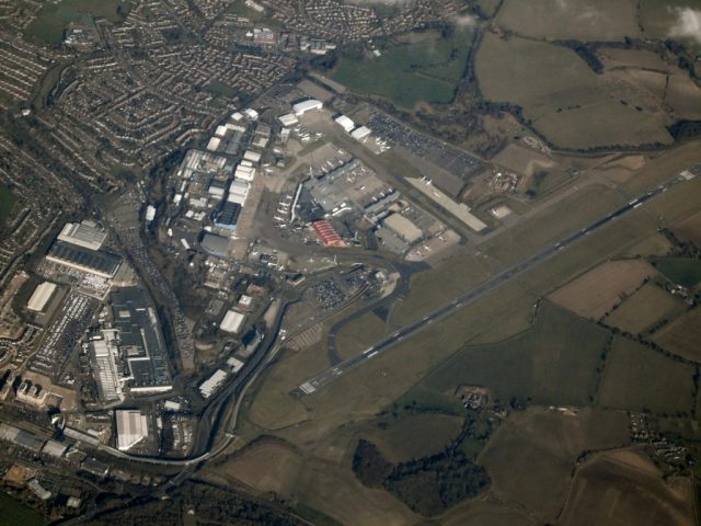 Flights suspended at Luton Airport due to car park fire incident Firefighters battling a blaze in a multistorey car park at London Luton Airport, with smoke rising above the terminal building.
