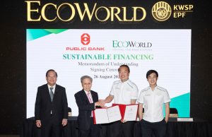 EcoWorld, Public Bank Ink Green Property Financing Deal EcoWorld and Public Bank representatives shaking hands at a signing ceremony for a green financing MoU at Eco Grandeur township.
