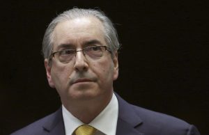 Eduardo Cunha Resigns as Brazil House Speaker Eduardo Cunha speaking at a podium in the Brazilian Chamber of Deputies during a legislative session.