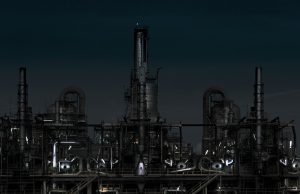 EU, G7 Ban Russian Diesel in Price Cap Blow A diesel fuel tanker truck parked at a European port with oil refinery smokestacks in the background under a cloudy sky.