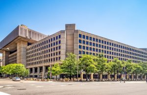 FBI Releases 1947-68 UFO Case File 62-HQ-83894 With Fewer Redactions A researcher scrolls through newly released FBI UFO documents on a laptop screen showing declassified pages from 1947-1968.