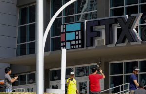 FTX Collapse Exposes $8 Billion Hole in Accounts A computer screen displays the FTX exchange website with a bankruptcy notice, reflecting the company's financial collapse in November 2022.