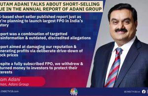 Adani Group Loses $104B After Hindenburg Fraud Allegations Gautam Adani speaking at a business conference, with the Adani Group logo displayed behind him.