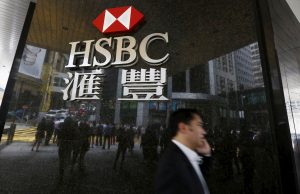 HSBC Faces $600M Penalties for Forex Manipulation Traders working on the floor of a busy foreign exchange market