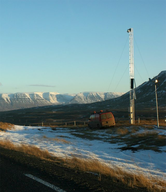 Icelandic Meteorological Office issues warning due to increased seismic activity Seismic monitoring equipment on a volcanic landscape near Reykjavík, with steam rising from Fagradalsfjall in the background.