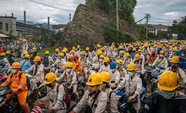 Indonesia Nickel Mining Protest Sulawesi Protesters gather near a nickel mining site in Indonesia, holding signs against land encroachment and displacement.