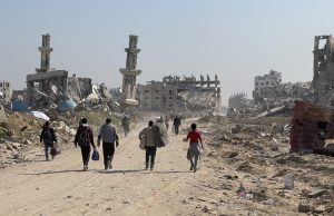 Israel-Hamas Ceasefire Ends After 58 Days, March 18 Smoke rises above Gaza skyline as Israeli tanks pull back and Red Cross convoys cross the border checkpoint on January 19, 2025.