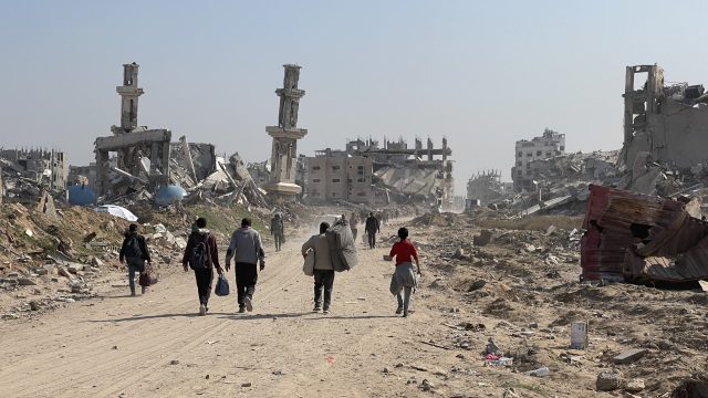 Grammy Awards red carpet event Smoke rises above Gaza skyline as Israeli tanks pull back and Red Cross convoys cross the border checkpoint on January 19, 2025.