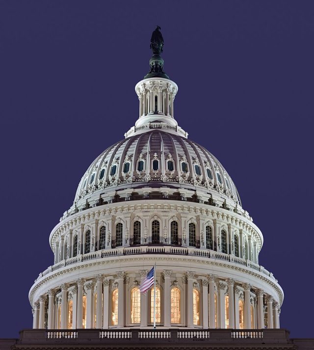 Joe Biden US Capitol building with lawmakers voting on legislation to suspend trade relations with Russia and ban oil imports.