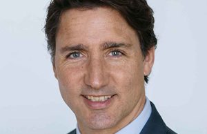 Trudeau Reaches Deal to Keep Power Until 2025 Justin Trudeau speaks at a podium in Toronto, announcing a political agreement with the New Democratic Party.