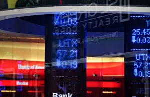 Malaysia Keeps Bursa Open Amid Permanent Lockdown Traders monitor stock prices on screens at Bursa Malaysia in Kuala Lumpur during the pandemic lockdown.