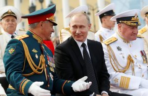 Sergei Shoigu Moved Aside as Russia Probes Defence Ministry Sergei Shoigu in military uniform at a press conference, with Russian flags in the background.