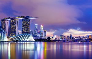Singapore Grants $10M for Arcturus Coronavirus Vaccine Lab technicians in protective gear handling vials of a potential RNA vaccine at a biotechnology facility.