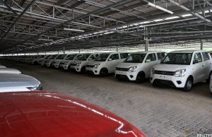 Taiwan Car Sales Surge 15% Despite Global Slump A row of new Toyota Corolla crossovers at a dealership in Taiwan, with a salesperson showing a car to a customer.