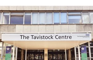 NHS England Shuts GIDS Youth Gender Clinic Exterior of the Tavistock Centre with NHS signage, symbolizing the shuttered youth gender service.